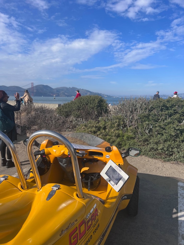 GoCar parked in front of the Golden Gate Bridge
